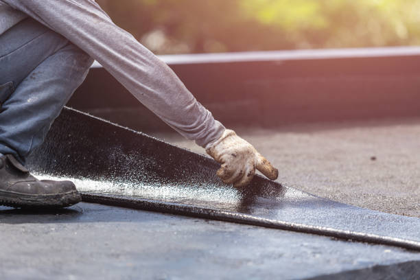 Professional Basement Waterproofing technician working in Woodville, VA